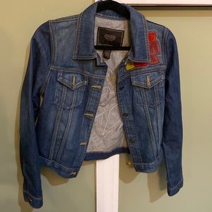 Worn once coach denim jacket with leather floral design